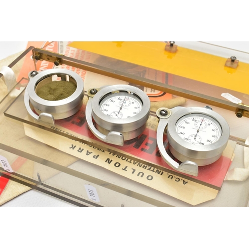 39 - MOTOR RACING INTEREST, to include two 'Nero Lemania' stopwatches encased in a triple watch hinged cu... 