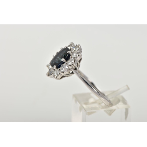 4 - AN 18CT WHITE GOLD, SAPPHIRE AND DIAMOND CLUSTER RING, set with a cushion-shaped mixed-cut sapphire,... 