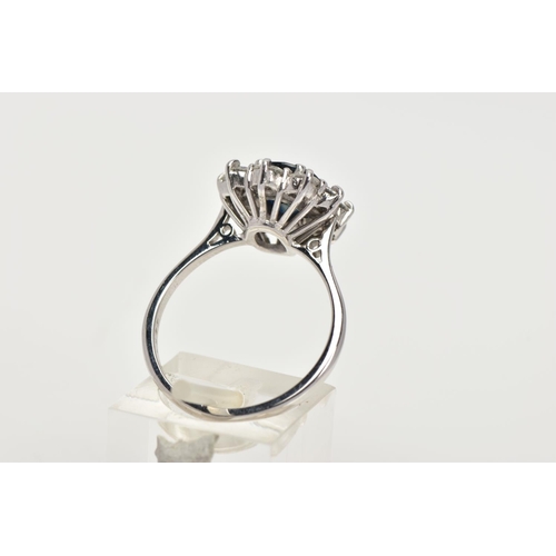 4 - AN 18CT WHITE GOLD, SAPPHIRE AND DIAMOND CLUSTER RING, set with a cushion-shaped mixed-cut sapphire,... 