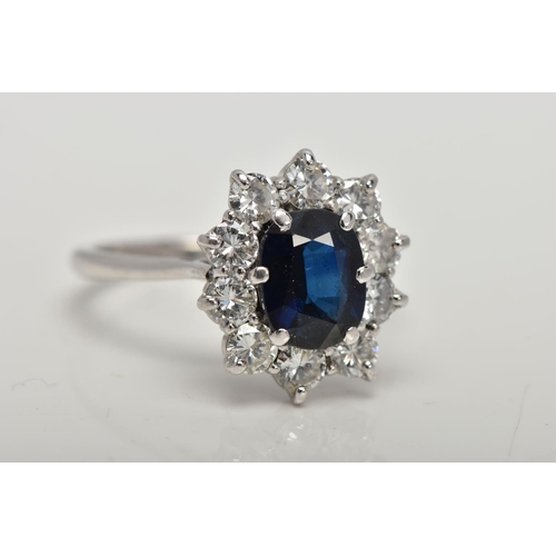 4 - AN 18CT WHITE GOLD, SAPPHIRE AND DIAMOND CLUSTER RING, set with a cushion-shaped mixed-cut sapphire,... 