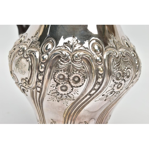 41 - A LATE VICTORIAN SILVER HOT WATER JUG OF BALUSTER FORM, the hinged domed cover with knopped finial, ... 