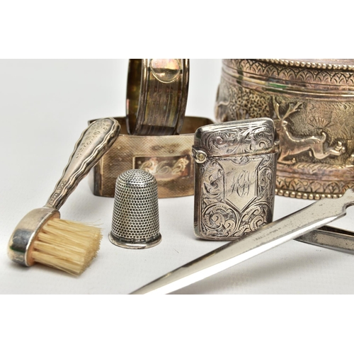 45 - A GROUP LOT OF SILVER AND WHITE METAL TO INCLUDE EIGHT ASSORTED SILVER NAPKIN RINGS, two of which ar... 