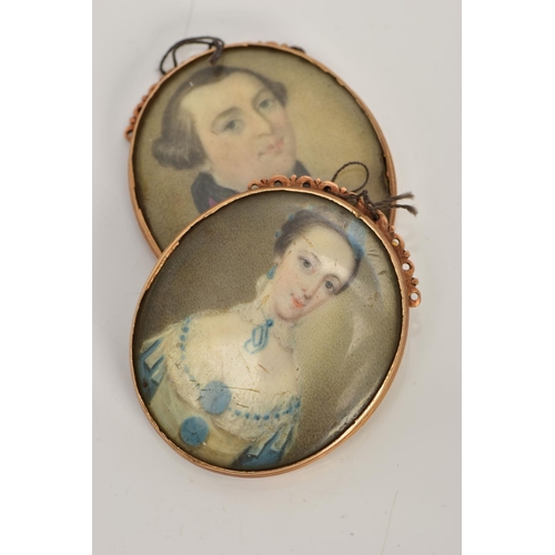 5 - TWO GOLD GEORGIAN PORTRAIT MINIATURE CLASPS, hand painted on ivory, one of a gentleman in a blue wai... 