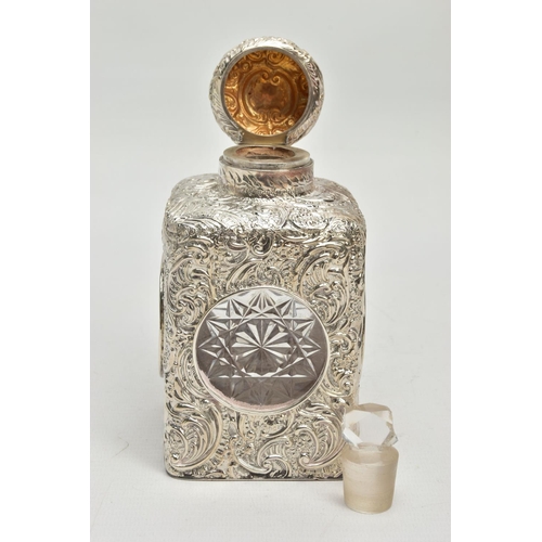 52 - A LATE VICTORIAN SILVER MOUNTED GLASS SCENT BOTTLE OF SQUARE OUTLINE, hinged circular cover with vac... 