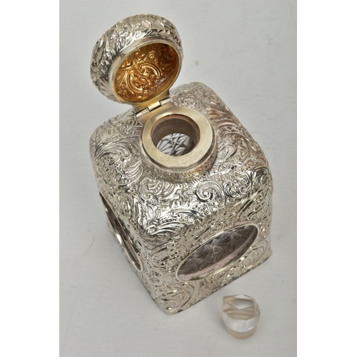 52 - A LATE VICTORIAN SILVER MOUNTED GLASS SCENT BOTTLE OF SQUARE OUTLINE, hinged circular cover with vac... 