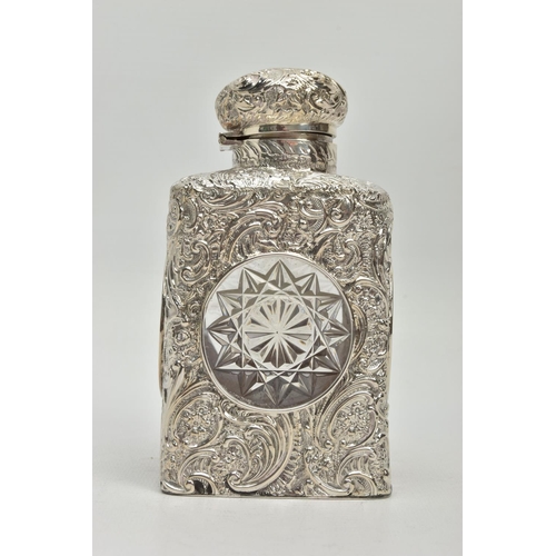 52 - A LATE VICTORIAN SILVER MOUNTED GLASS SCENT BOTTLE OF SQUARE OUTLINE, hinged circular cover with vac... 