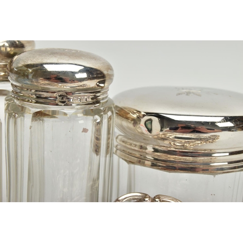 54 - A PAIR OF LATE VICTORIAN SILVER HEART SHAPED BONBON DISHES AND SIX SILVER TOPPED GLASS TOILET JARS, ... 