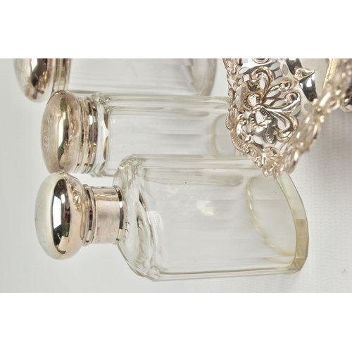 54 - A PAIR OF LATE VICTORIAN SILVER HEART SHAPED BONBON DISHES AND SIX SILVER TOPPED GLASS TOILET JARS, ... 