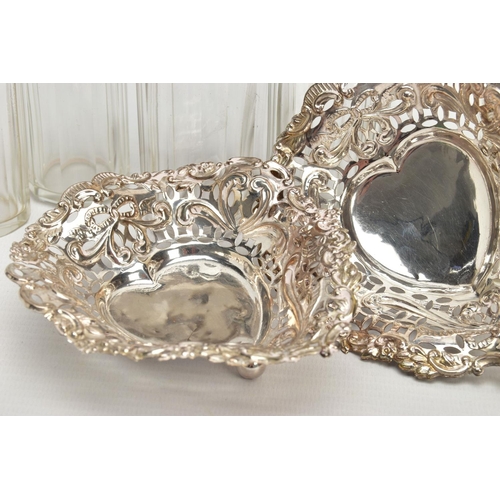 54 - A PAIR OF LATE VICTORIAN SILVER HEART SHAPED BONBON DISHES AND SIX SILVER TOPPED GLASS TOILET JARS, ... 