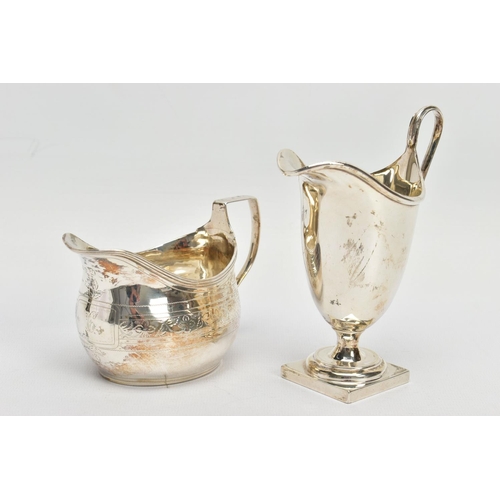 62 - TWO SILVER HELMET SHAPED CREAM JUGS, comprising a George III example with bright cut decoration, rec... 