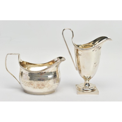 62 - TWO SILVER HELMET SHAPED CREAM JUGS, comprising a George III example with bright cut decoration, rec... 