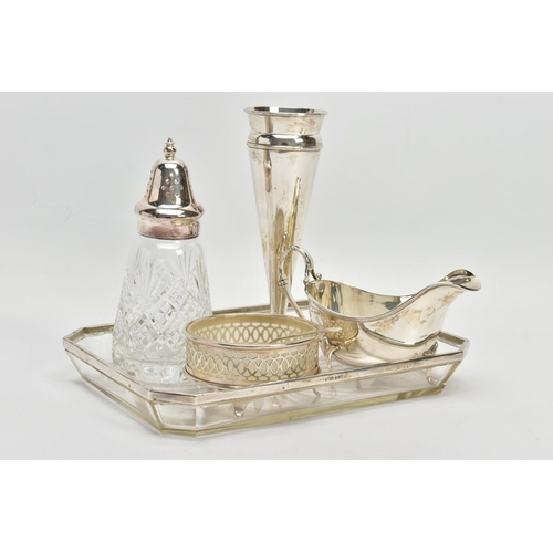 64 - A PARCEL OF SILVER AND SILVER MOUNTED ITEMS, comprising a George V sauce boat, on three cabriole leg... 