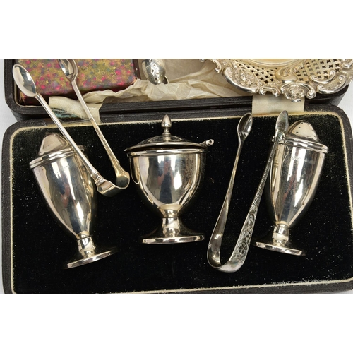 70 - A LATE VICTORIAN SILVER HEART SHAPED BON BON DISH, THREE PAIRS OF SUGAR TONGS AND CASED PART CONDIME... 