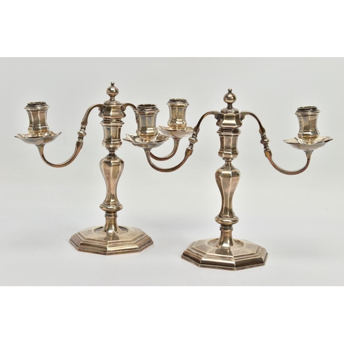 75 - A PAIR OF GEORGE I STYLE SILVER CANDLESTICKS OF OCTAGONAL FORM, baluster stems, stepped octagonal ba... 