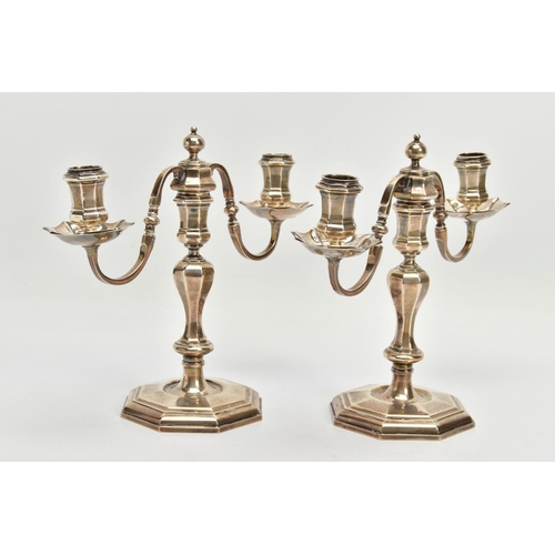 75 - A PAIR OF GEORGE I STYLE SILVER CANDLESTICKS OF OCTAGONAL FORM, baluster stems, stepped octagonal ba... 