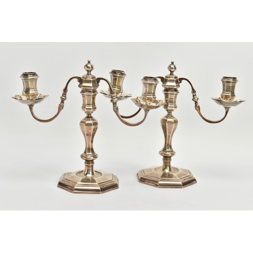 75 - A PAIR OF GEORGE I STYLE SILVER CANDLESTICKS OF OCTAGONAL FORM, baluster stems, stepped octagonal ba... 