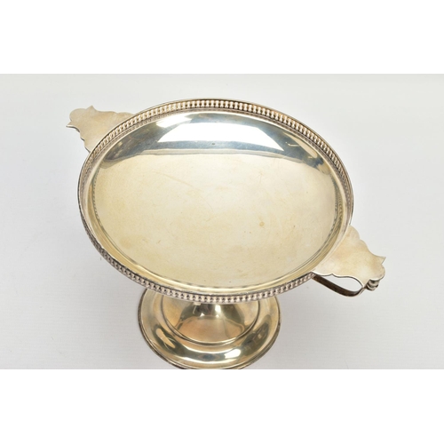 82 - A GEORGE V SILVER TWIN HANDLED COMPORT, with balustrade pierced gallery with flattened lugs over ang... 