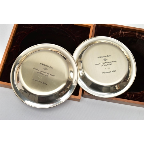 85 - TWO ELIZABETH II STERLING SILVER BERNARD BUFFET PLATES MOUNTED IN EASEL BACK FRAMES, etched with a d... 