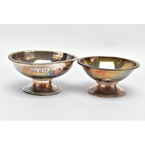 86 - TWO ELIZABETH II GEORGE HENRY HART FOR THE GUILD OF HANDICRAFT SILVER BOWLS, the first a lightly pla... 