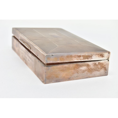 88 - AN ELIZABETH II SILVER CIGARETTE BOX OF RECTANGULAR FORM, engine turned and vacant cartouche, engrav... 