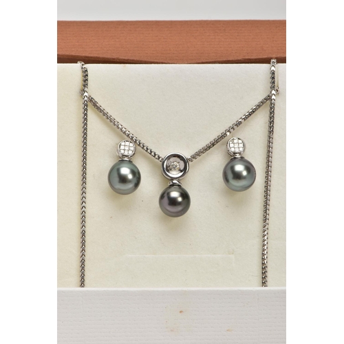 9 - A MODERN TAHITIAN PEARL AND DIAMOND PENDANT AND EARRING SET, pendant designed as a single articulate... 