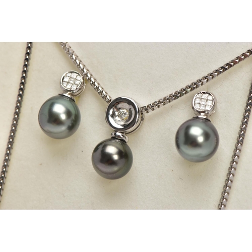 9 - A MODERN TAHITIAN PEARL AND DIAMOND PENDANT AND EARRING SET, pendant designed as a single articulate... 