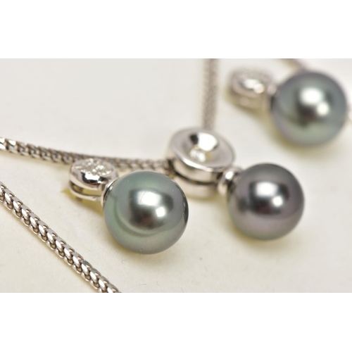 9 - A MODERN TAHITIAN PEARL AND DIAMOND PENDANT AND EARRING SET, pendant designed as a single articulate... 