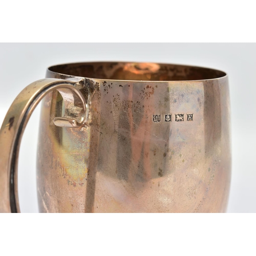 91 - AN ELIZABETH II SILVER MUG, a bell shaped mug with a scrolled handle and skirted foot, engraved 'M.C... 