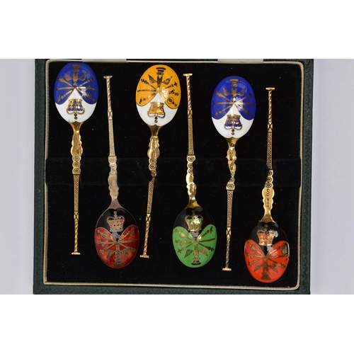 97 - A CASED SET OF SIX GEORGE V SILVER GILT AND HARLEQUIN ENAMEL COFFEE SPOONS, engine turned decoration... 