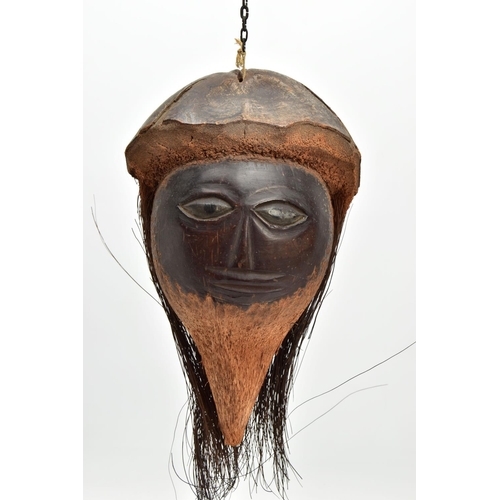 217 - A 19TH/ EARLY 20TH CENTURY CARVED COCONUT, the outer shell and husk forming hat and hair, the inner ... 