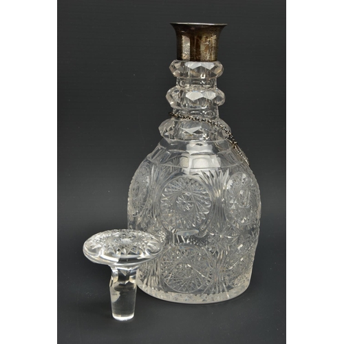 222 - AN EARLY 19TH CENTURY PRUSSIAN SHAPED GLASS  DECANTER AND A GEORGE V GLASS DECANTER, the early 19th ... 