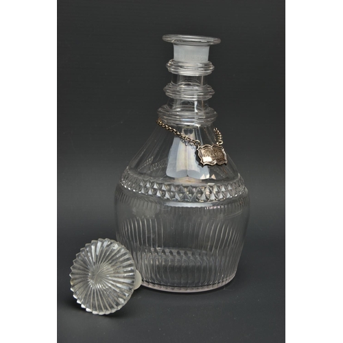 222 - AN EARLY 19TH CENTURY PRUSSIAN SHAPED GLASS  DECANTER AND A GEORGE V GLASS DECANTER, the early 19th ... 