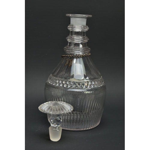 222 - AN EARLY 19TH CENTURY PRUSSIAN SHAPED GLASS  DECANTER AND A GEORGE V GLASS DECANTER, the early 19th ... 