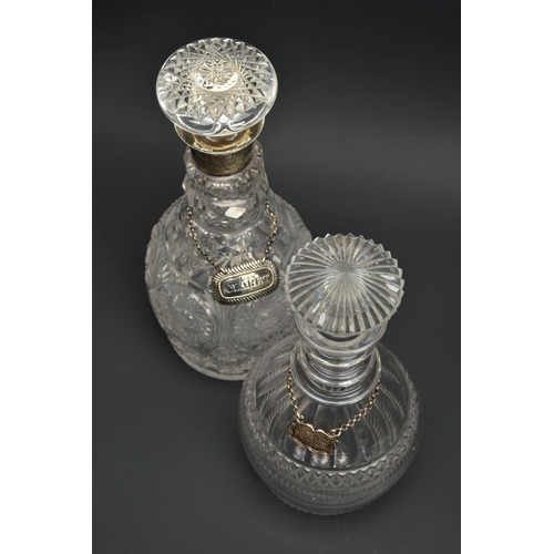 222 - AN EARLY 19TH CENTURY PRUSSIAN SHAPED GLASS  DECANTER AND A GEORGE V GLASS DECANTER, the early 19th ... 