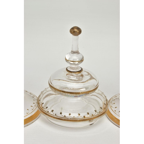 225 - A PAIR OF LATE 19TH CENTURY CONTINENTAL GLASS JARS OF CONICAL FORM, ONE WITH A COVER, the domed cove... 