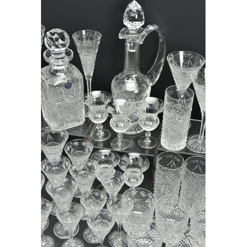 228 - A SUITE OF STUART CRYSTAL BEACONSFIELD PATTERN DRINKING GLASSES AND DECANTERS, comprising a square d... 