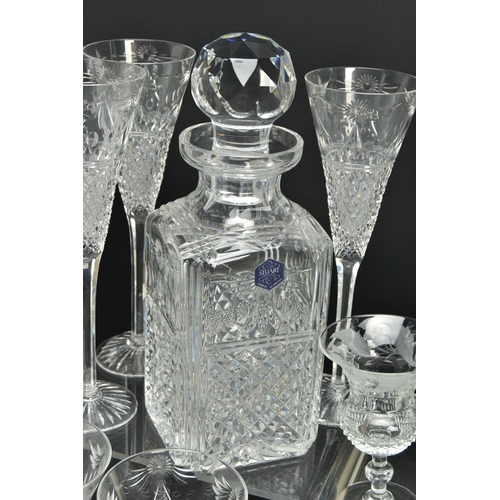 228 - A SUITE OF STUART CRYSTAL BEACONSFIELD PATTERN DRINKING GLASSES AND DECANTERS, comprising a square d... 