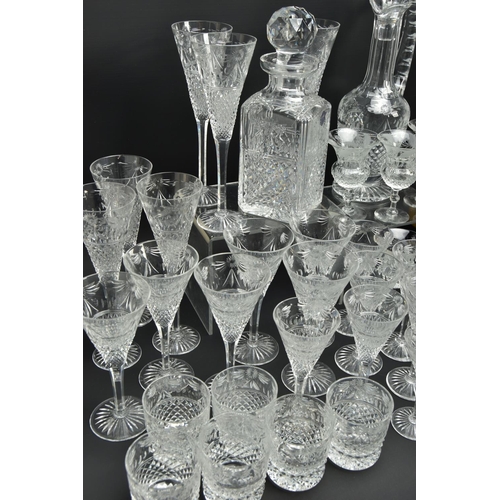 228 - A SUITE OF STUART CRYSTAL BEACONSFIELD PATTERN DRINKING GLASSES AND DECANTERS, comprising a square d... 