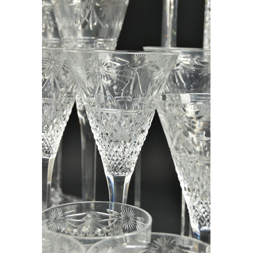 228 - A SUITE OF STUART CRYSTAL BEACONSFIELD PATTERN DRINKING GLASSES AND DECANTERS, comprising a square d... 