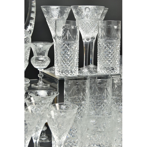 228 - A SUITE OF STUART CRYSTAL BEACONSFIELD PATTERN DRINKING GLASSES AND DECANTERS, comprising a square d... 