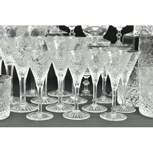 228 - A SUITE OF STUART CRYSTAL BEACONSFIELD PATTERN DRINKING GLASSES AND DECANTERS, comprising a square d... 