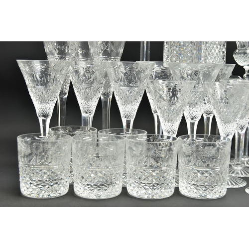 228 - A SUITE OF STUART CRYSTAL BEACONSFIELD PATTERN DRINKING GLASSES AND DECANTERS, comprising a square d... 