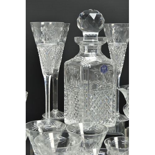 228 - A SUITE OF STUART CRYSTAL BEACONSFIELD PATTERN DRINKING GLASSES AND DECANTERS, comprising a square d... 