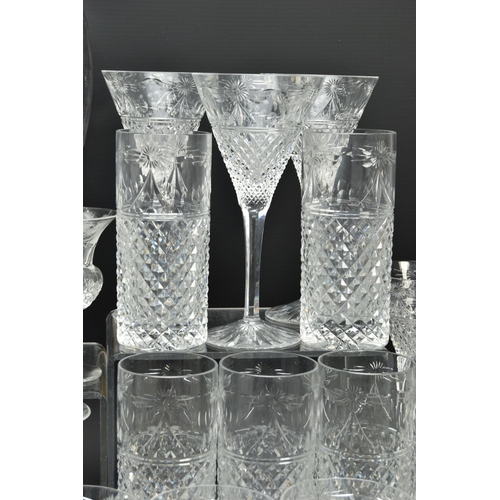 228 - A SUITE OF STUART CRYSTAL BEACONSFIELD PATTERN DRINKING GLASSES AND DECANTERS, comprising a square d... 