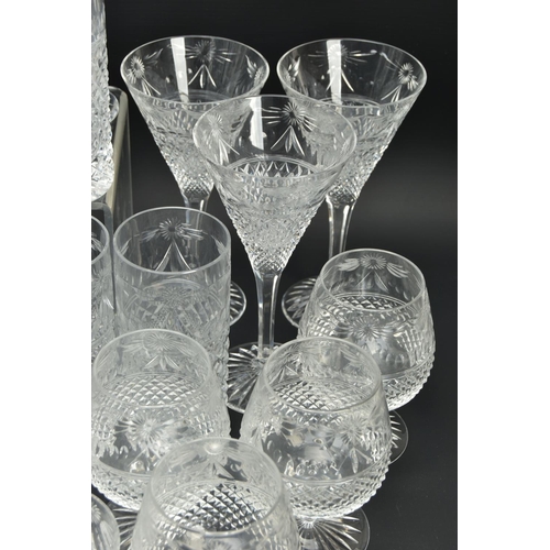 228 - A SUITE OF STUART CRYSTAL BEACONSFIELD PATTERN DRINKING GLASSES AND DECANTERS, comprising a square d... 