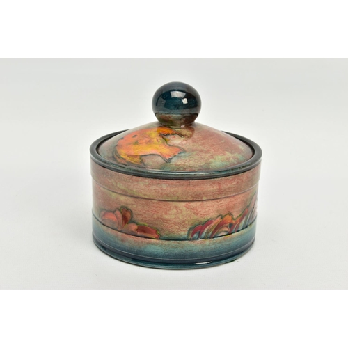 229 - A WILLIAM MOORCROFT FLAMBE JAR AND COVER, of circular form, (probably a humidor), spherical finial, ... 