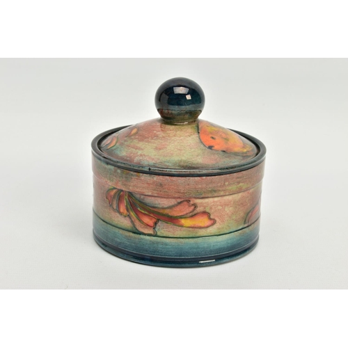 229 - A WILLIAM MOORCROFT FLAMBE JAR AND COVER, of circular form, (probably a humidor), spherical finial, ... 