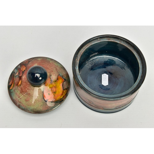 229 - A WILLIAM MOORCROFT FLAMBE JAR AND COVER, of circular form, (probably a humidor), spherical finial, ... 