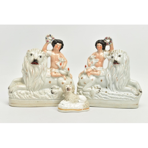 230 - A PAIR OF VICTORIAN STAFFORDSHIRE POTTERY FIGURE GROUPS, modelled as a naked boy holding a garland a... 