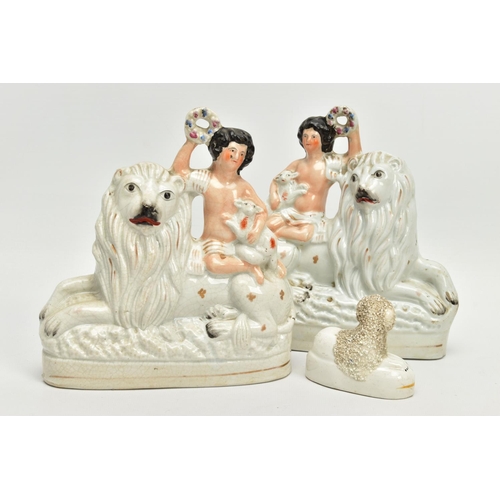 230 - A PAIR OF VICTORIAN STAFFORDSHIRE POTTERY FIGURE GROUPS, modelled as a naked boy holding a garland a... 